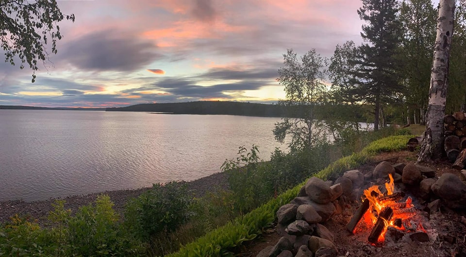 Relax by the fire at Eagle Lake Sporting Camps